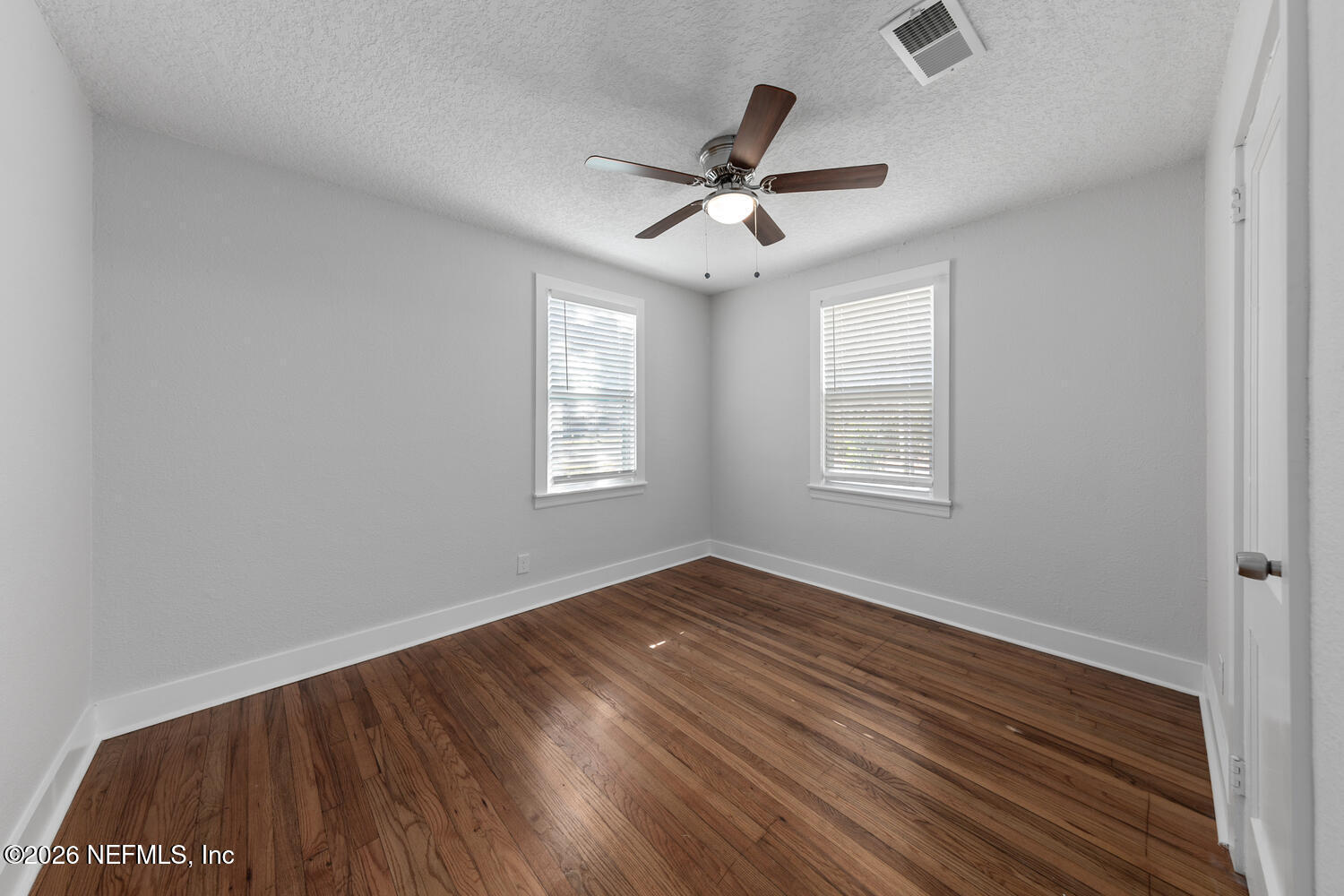 715 Ralph Street Jacksonville, FL 32204 - Photo 15 of 21 a view of empty room with wooden floor and fan
