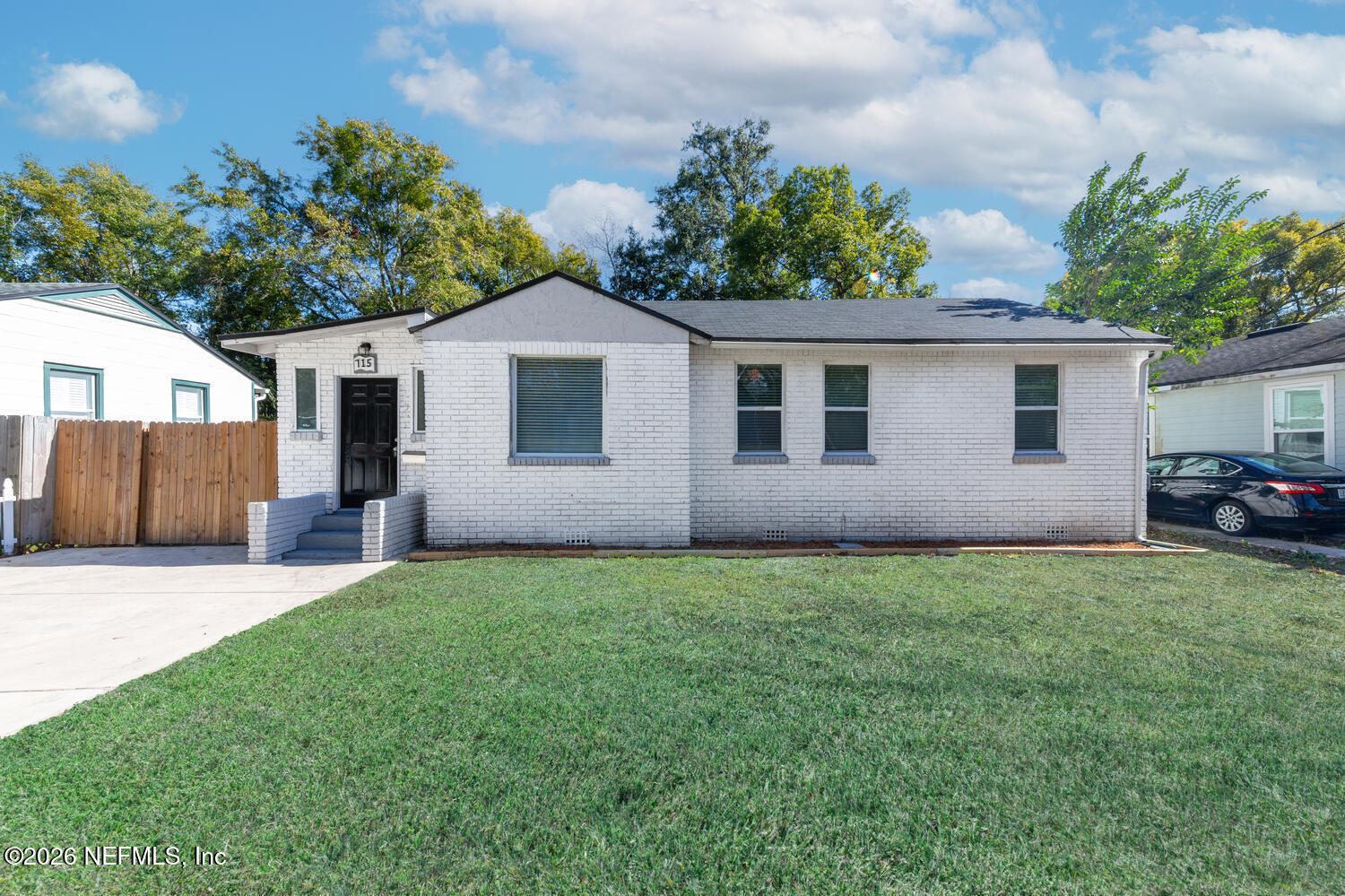 715 Ralph Street Jacksonville, FL 32204 - Photo 1 of 21 a front view of a house with a yard and garage