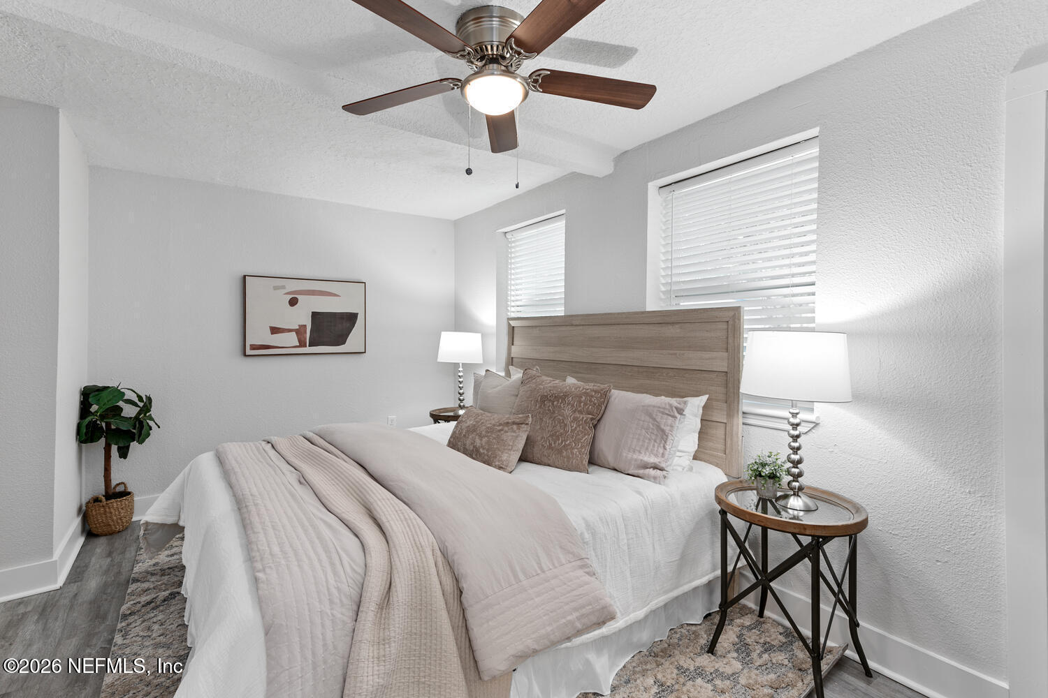 715 Ralph Street Jacksonville, FL 32204 - Photo 9 of 21 a bedroom with a bed and a chandelier