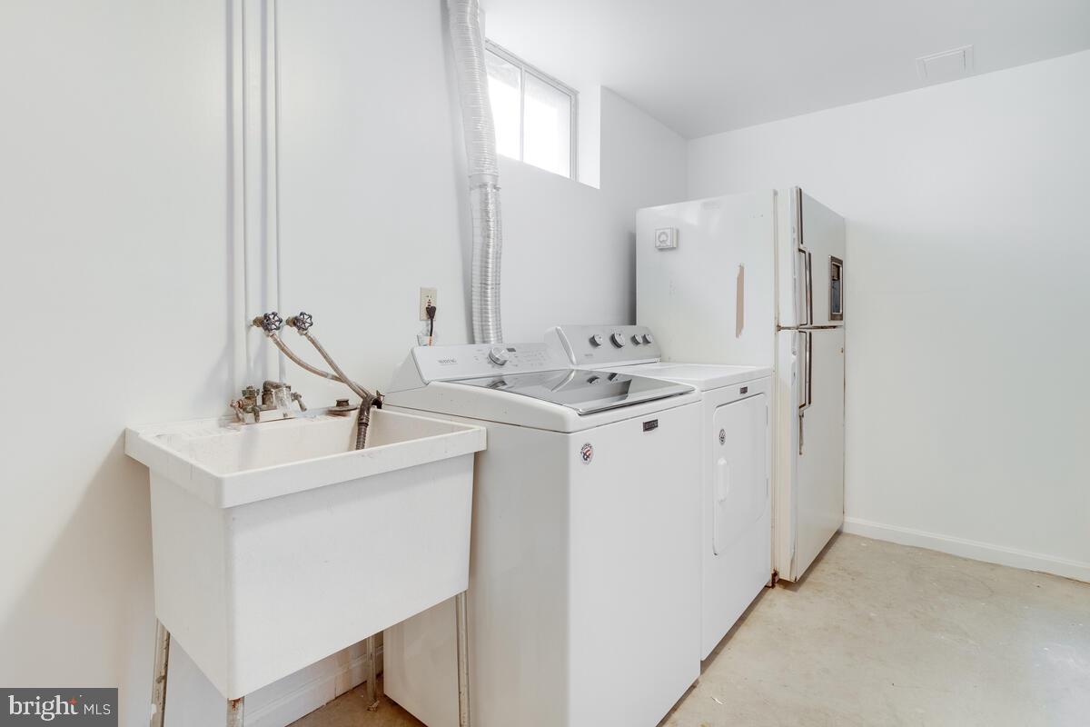14226 Summit Lane Laurel, MD 20708 - Photo 44 of 58 Laundry room with utility tub and 2nd refrigerator