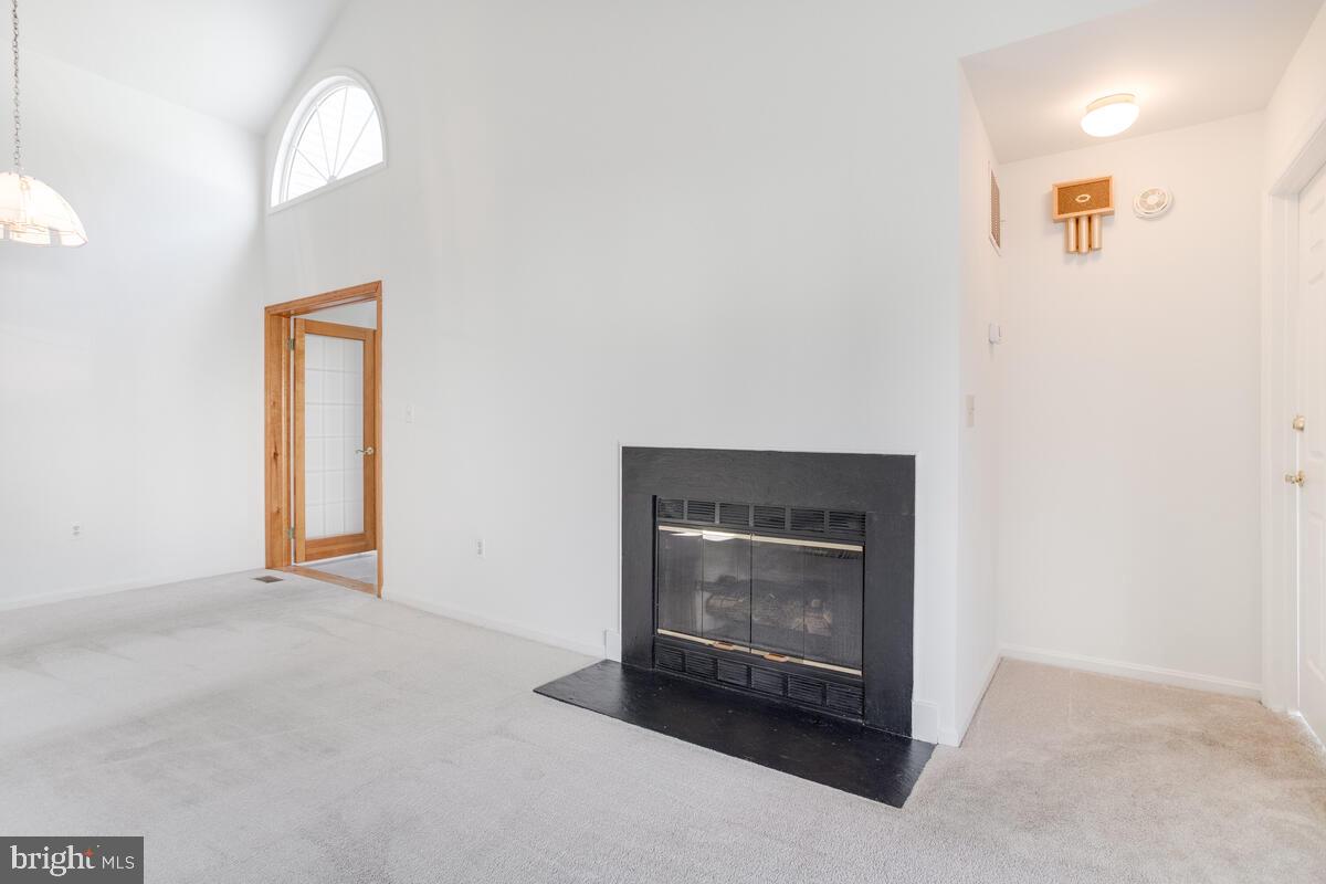 14226 Summit Lane Laurel, MD 20708 - Photo 9 of 58 Fireplace is in living room and has glass doors