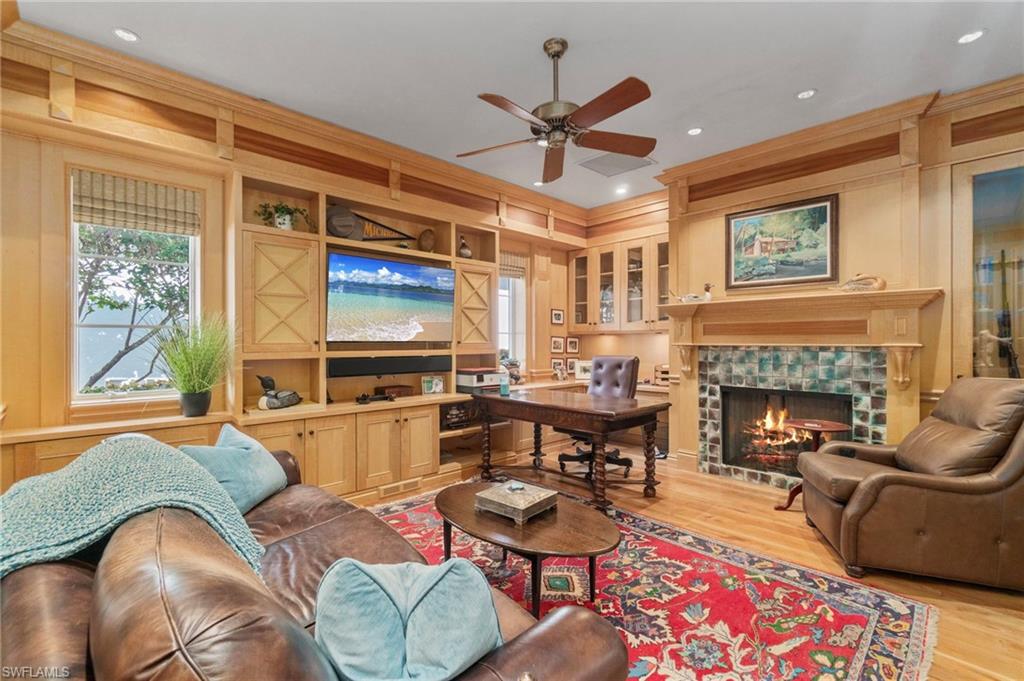 29150 Positano Lane Naples, FL 34110 - Photo 11 of 50 a living room with furniture fireplace and flat screen tv