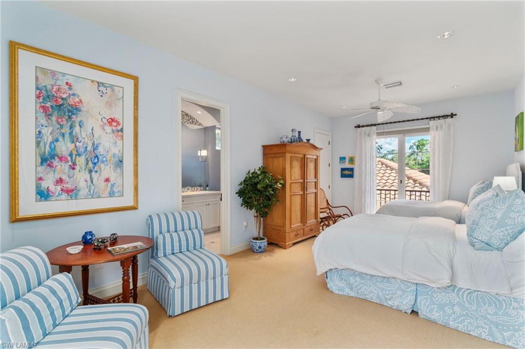 29150 Positano Lane Naples, FL 34110 - Photo 20 of 50 a bedroom with furniture and a large window