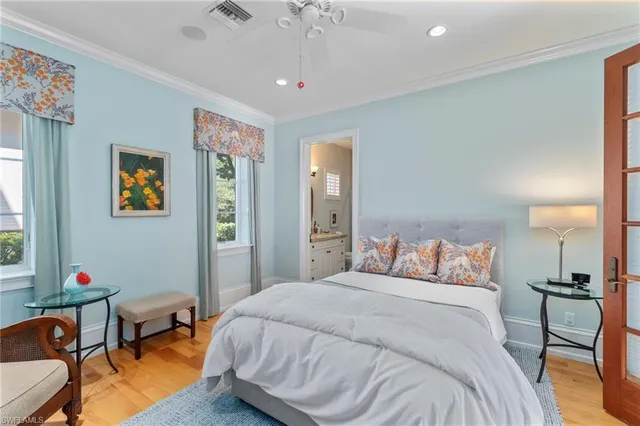 a bedroom with a bed and a table