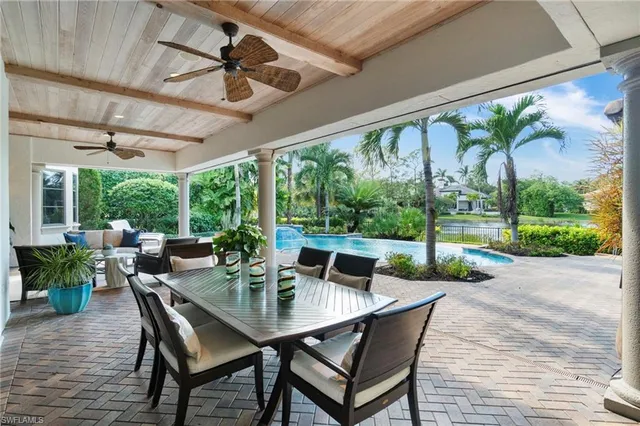 a view of an outdoor dining space with a table and chairs