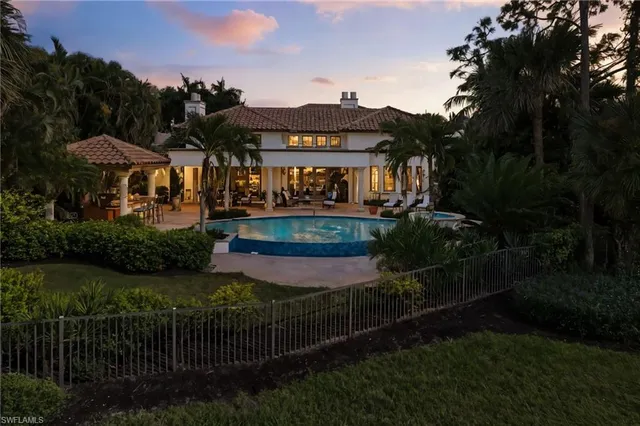 a view of a house with garden and a yard
