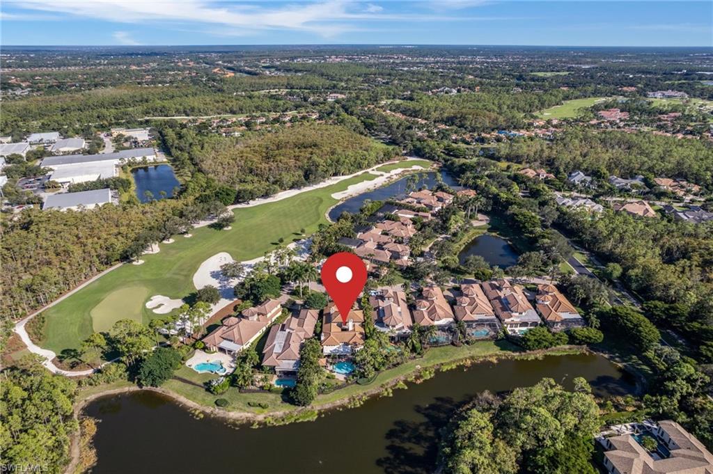 29150 Positano Lane Naples, FL 34110 - Photo 40 of 50 an aerial view of residential houses with outdoor space