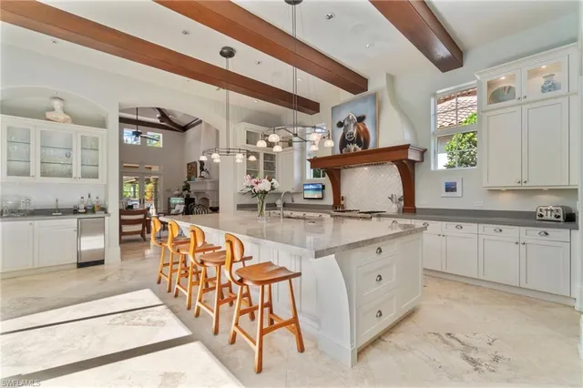 a kitchen with stainless steel appliances granite countertop a sink and cabinets