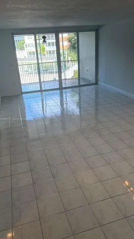 a view of an empty room and a window
