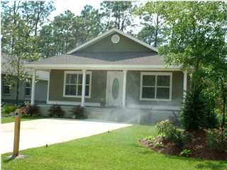 119 North 3rd Street Santa Rosa Beach, FL 32459 - Photo 1 of 18 a front view of a house with a yard
