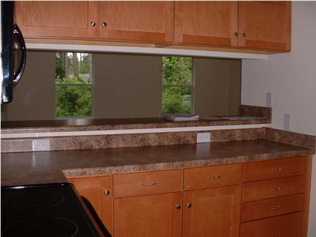 119 North 3rd Street Santa Rosa Beach, FL 32459 - Photo 11 of 18 a kitchen with a sink and cabinets