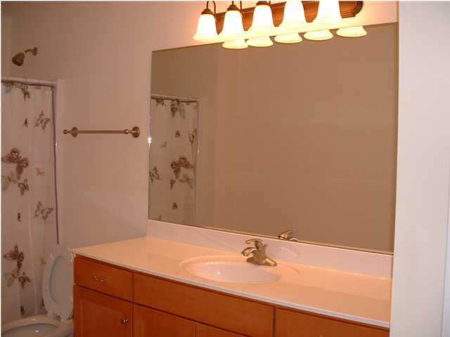 119 North 3rd Street Santa Rosa Beach, FL 32459 - Photo 13 of 18 a bathroom with a sink and a mirror
