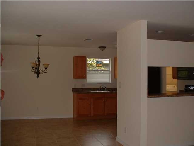 119 North 3rd Street Santa Rosa Beach, FL 32459 - Photo 14 of 18 a view of a hallway with a kitchen space