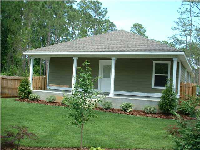 119 North 3rd Street Santa Rosa Beach, FL 32459 - Photo 5 of 18 a front view of a house with garden