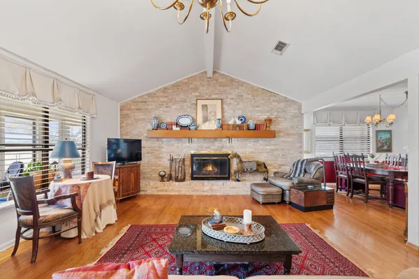 a bed room with furniture and a fireplace