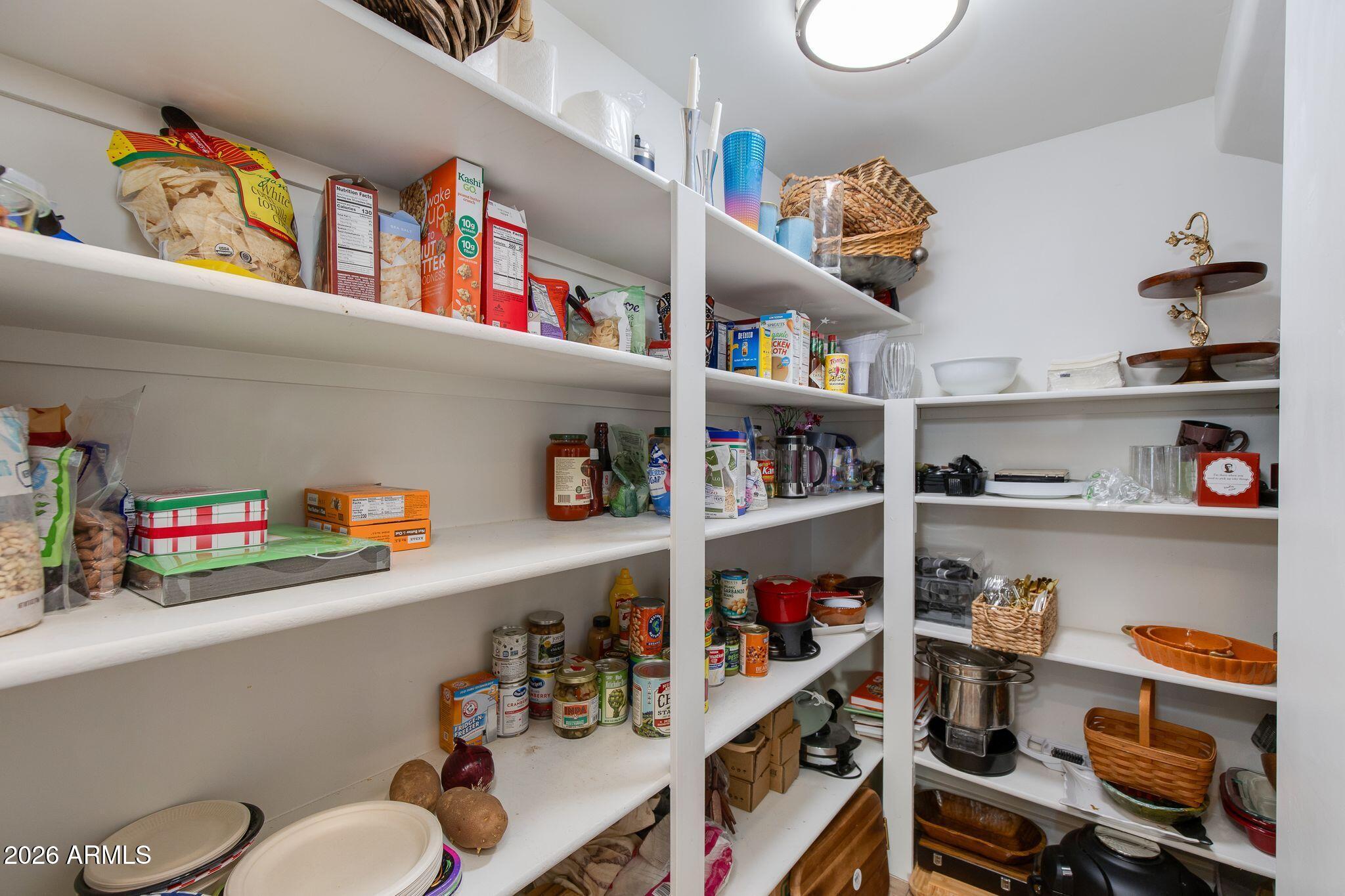 5901 East Restin Road Cave Creek, AZ 85331 - Photo 23 of 101 a room with a book shelf and a book shelf