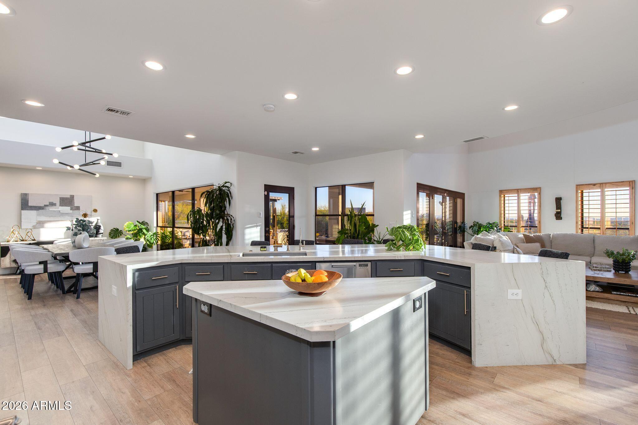 5901 East Restin Road Cave Creek, AZ 85331 - Photo 25 of 101 a kitchen with sink a counter top space and living room view