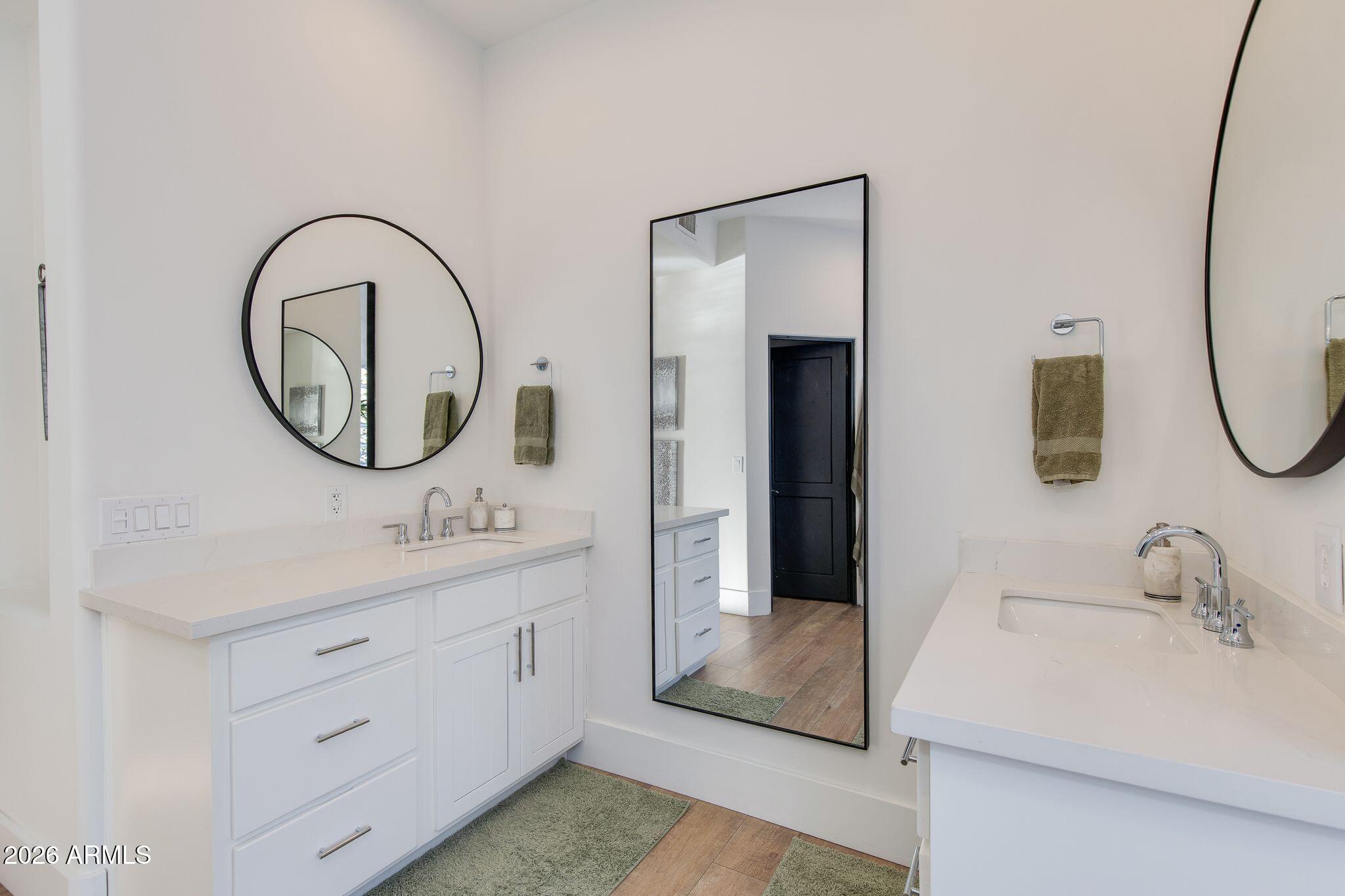 5901 East Restin Road Cave Creek, AZ 85331 - Photo 34 of 101 a bathroom with a sink and a mirror