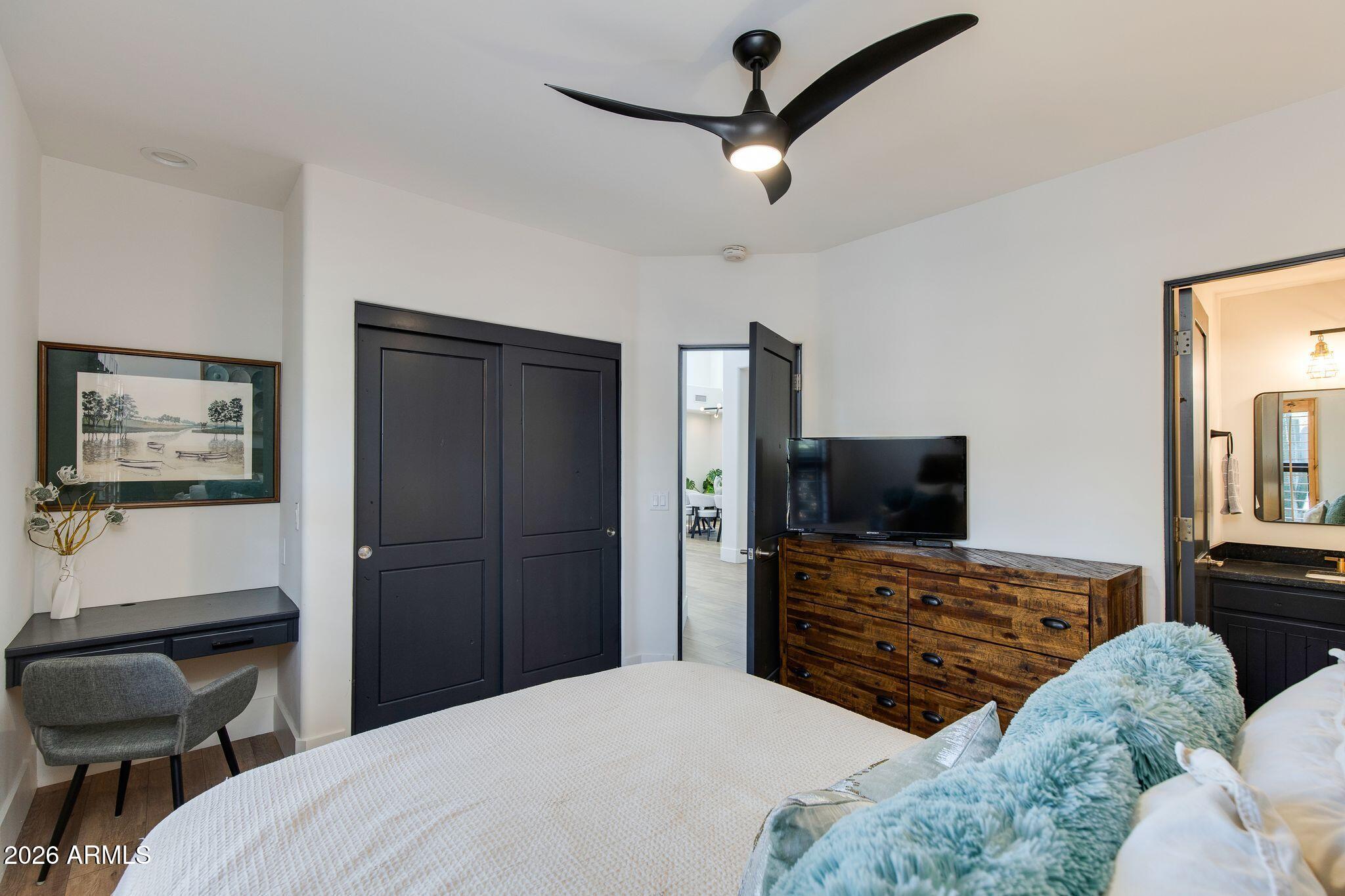 5901 East Restin Road Cave Creek, AZ 85331 - Photo 41 of 101 a bedroom with a bed and a flat screen tv