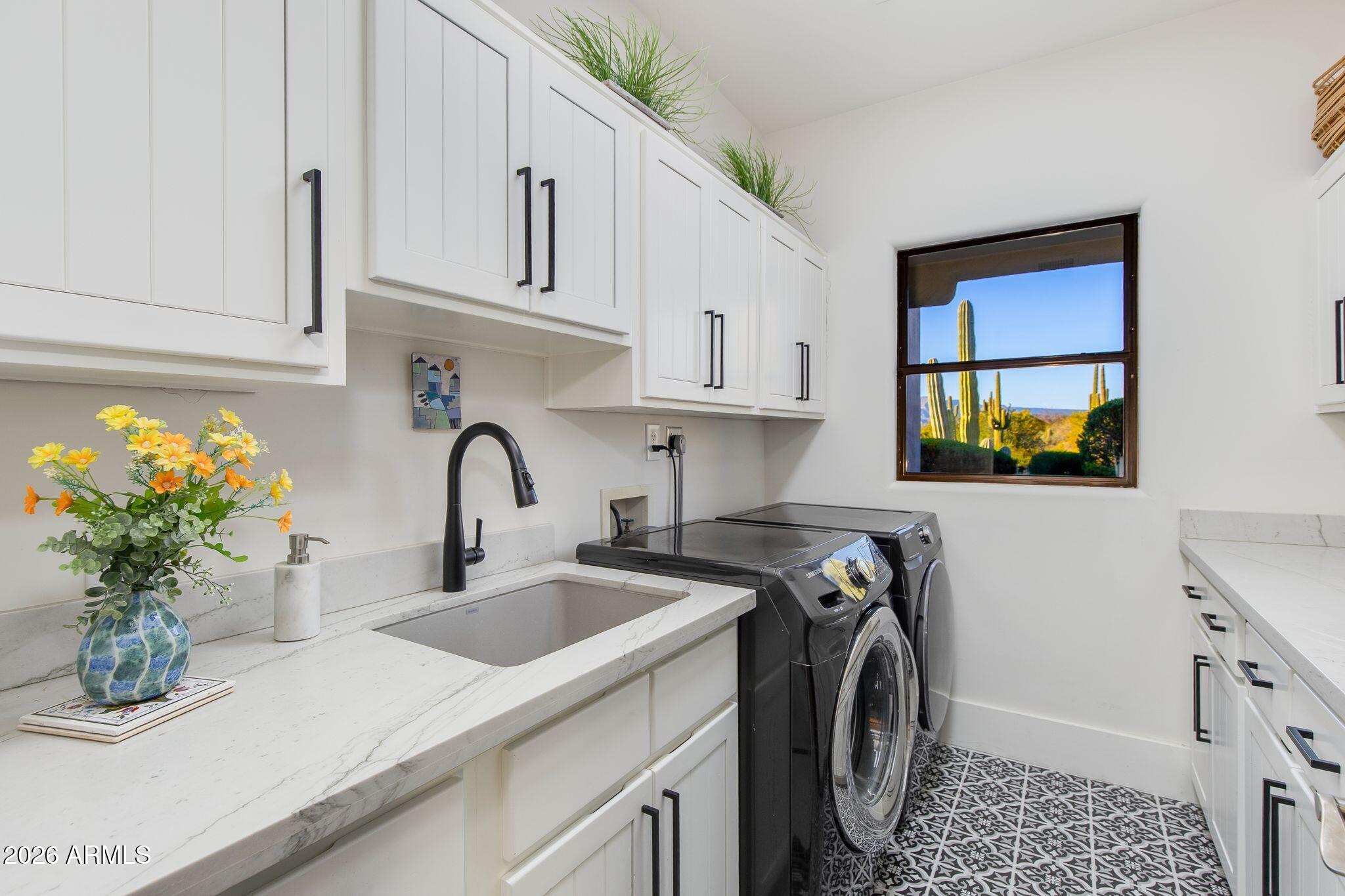 5901 East Restin Road Cave Creek, AZ 85331 - Photo 50 of 101 a kitchen with a sink a stove and a window
