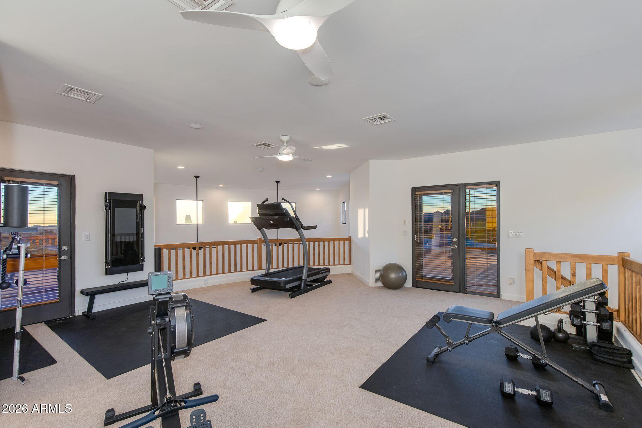 5901 East Restin Road Cave Creek, AZ 85331 - Photo 53 of 101 a view of a room with gym equipment