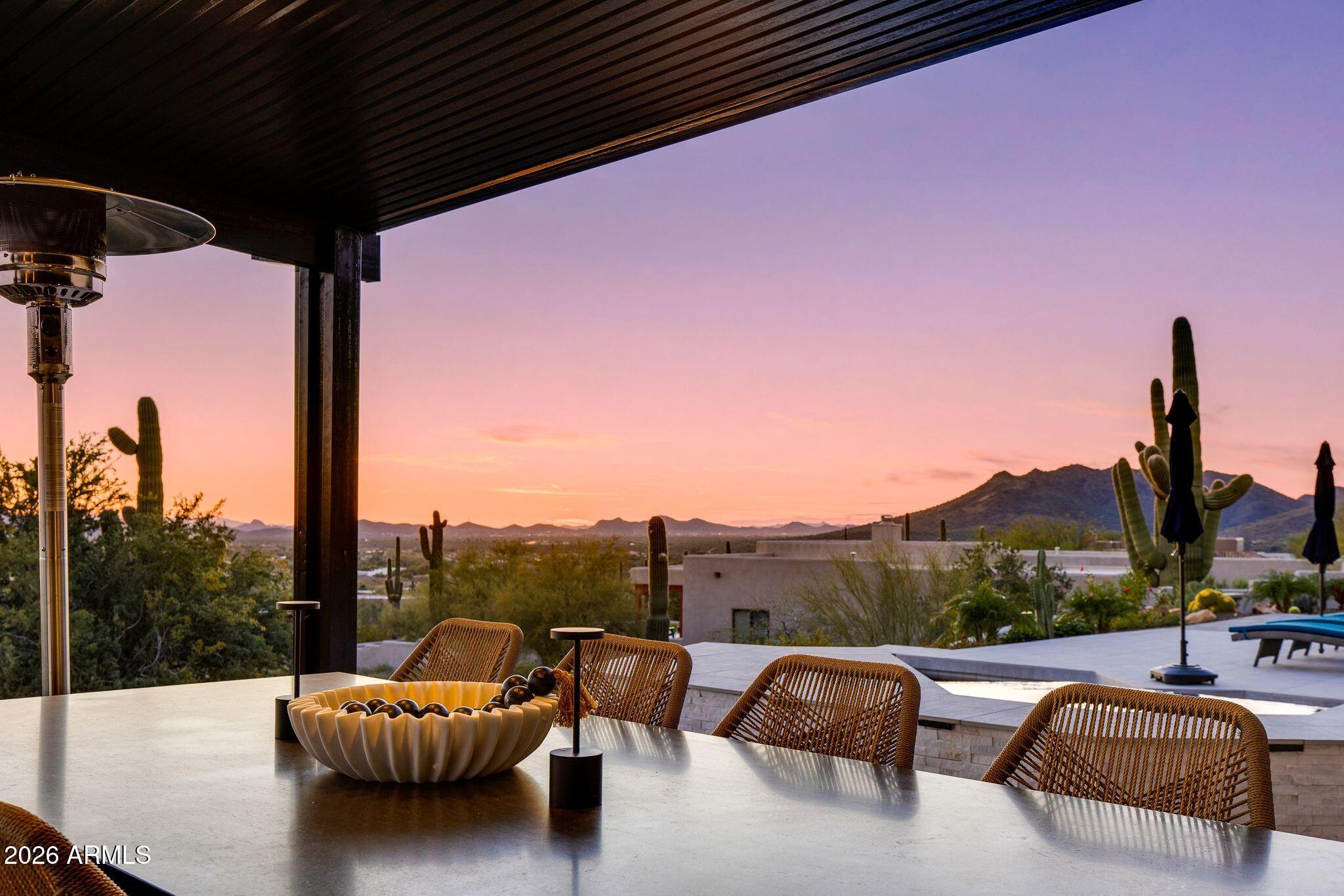 5901 East Restin Road Cave Creek, AZ 85331 - Photo 64 of 101 a balcony with outdoor seating and water view