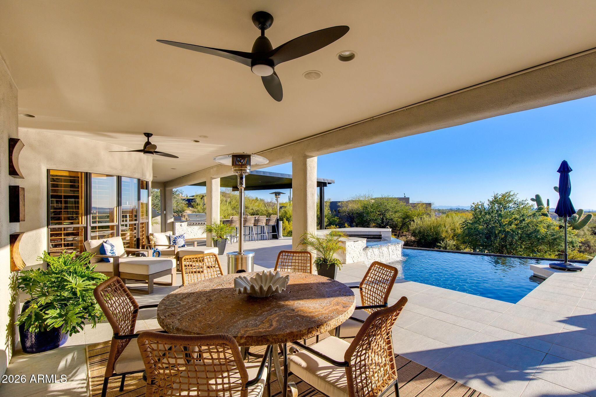 5901 East Restin Road Cave Creek, AZ 85331 - Photo 80 of 101 a view of a dining room with furniture window and outside view