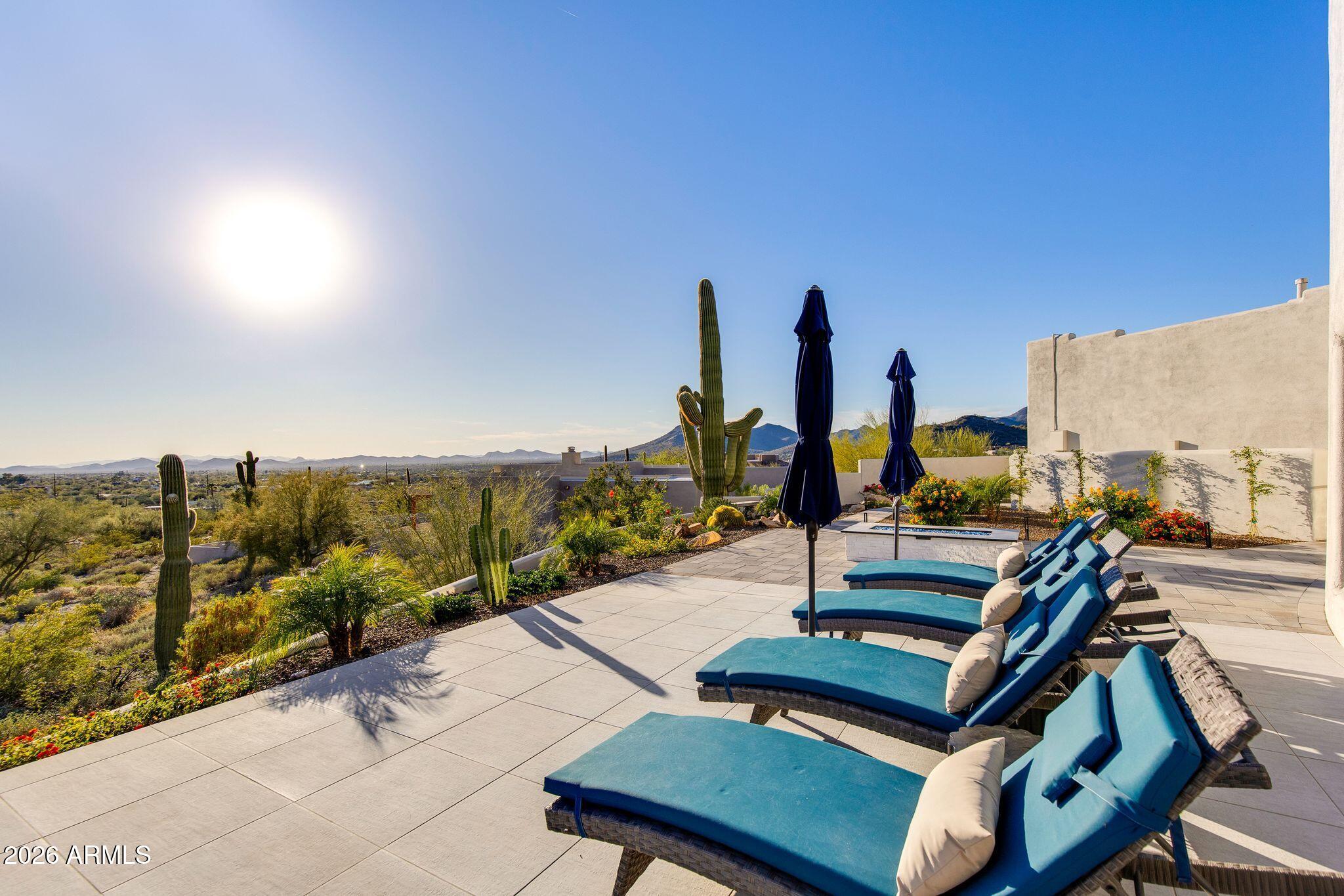 5901 East Restin Road Cave Creek, AZ 85331 - Photo 88 of 101 a view of a terrace with chairs