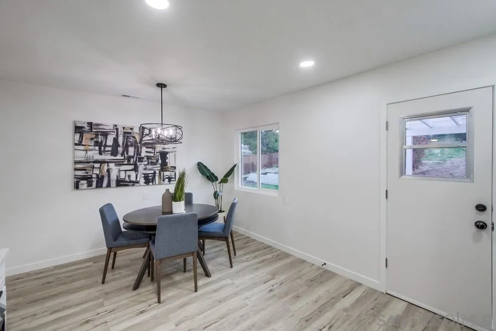 1839 Yettford Road Vista, CA 92083 - Photo 15 of 42 a view of a dining room with furniture and wooden floor