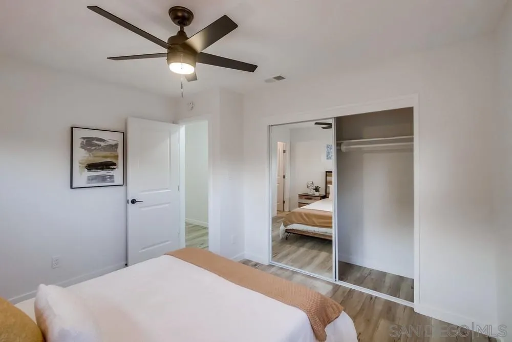 1839 Yettford Road Vista, CA 92083 - Photo 26 of 42 a bedroom with a bed and a ceiling fan