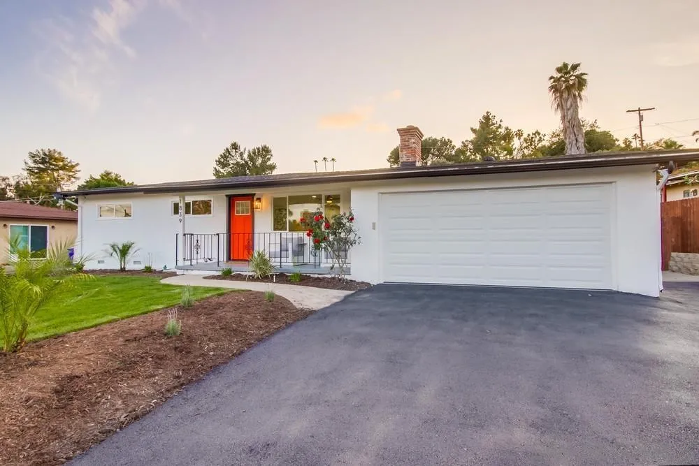 1839 Yettford Road Vista, CA 92083 - Photo 3 of 42 a view of a house with a backyard and a garage