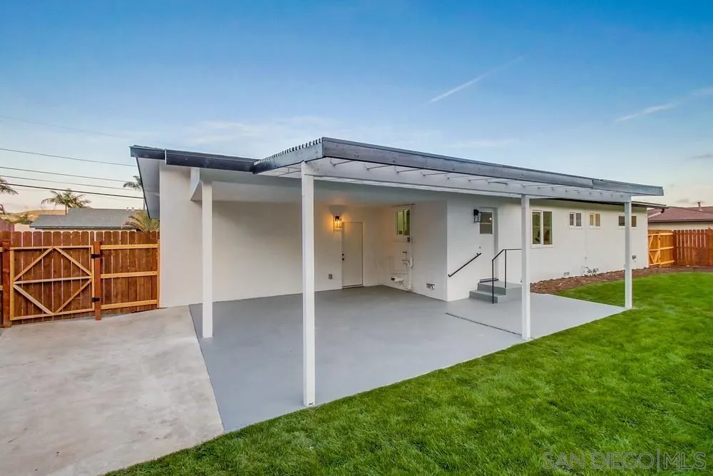 1839 Yettford Road Vista, CA 92083 - Photo 35 of 42 an outdoor view of house with backyard and glass windows
