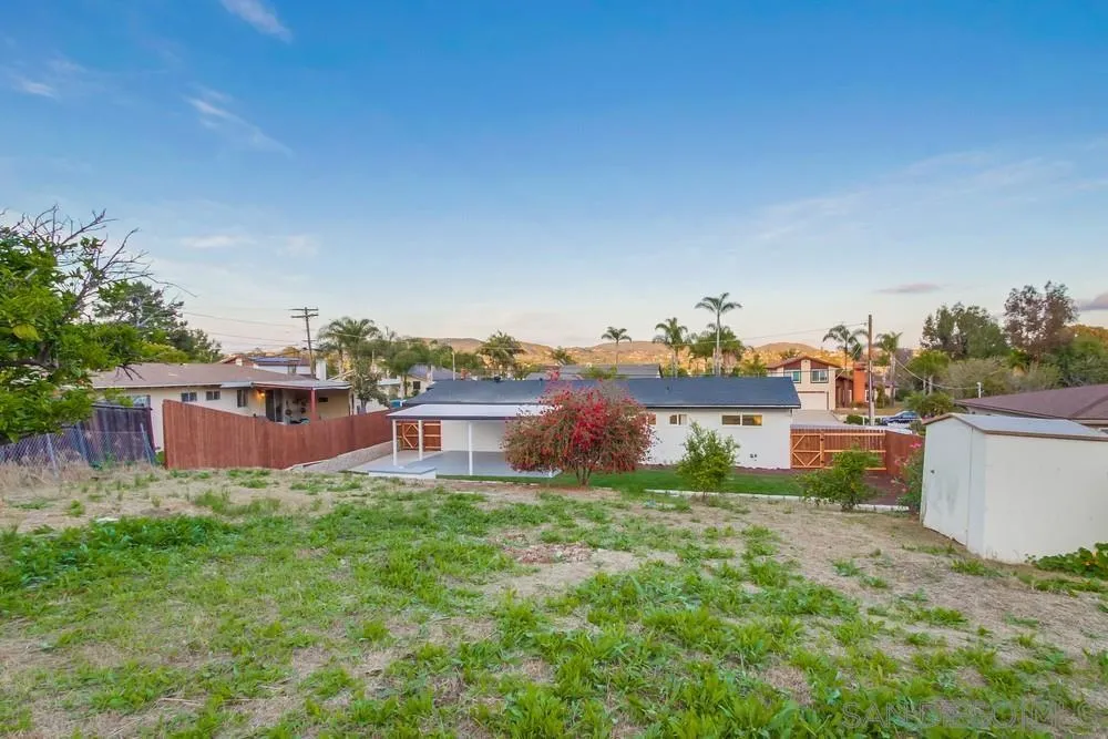 1839 Yettford Road Vista, CA 92083 - Photo 40 of 42 a view of a house with a big yard and large trees