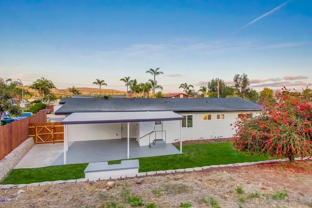 1839 Yettford Road Vista, CA 92083 - Photo 42 of 42 a front view of a house with a yard and garage