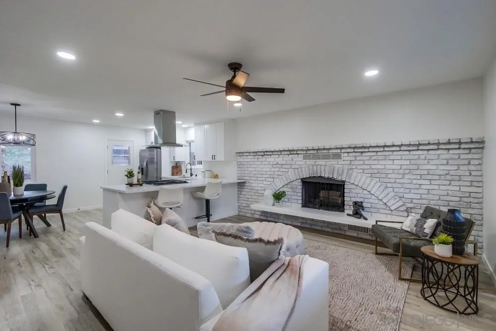 1839 Yettford Road Vista, CA 92083 - Photo 7 of 42 a living room with furniture and a fireplace