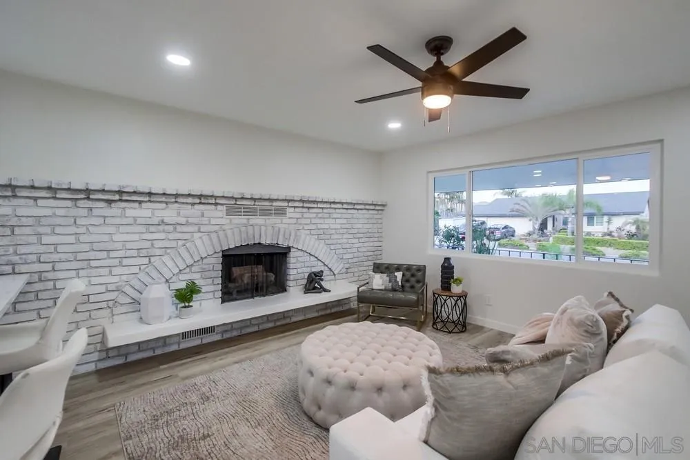 1839 Yettford Road Vista, CA 92083 - Photo 8 of 42 a living room with furniture and a fireplace