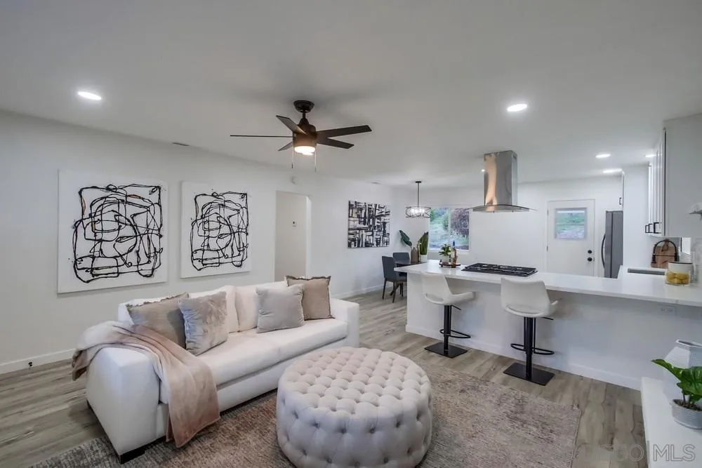 1839 Yettford Road Vista, CA 92083 - Photo 10 of 42 a living room with furniture and a large mirror