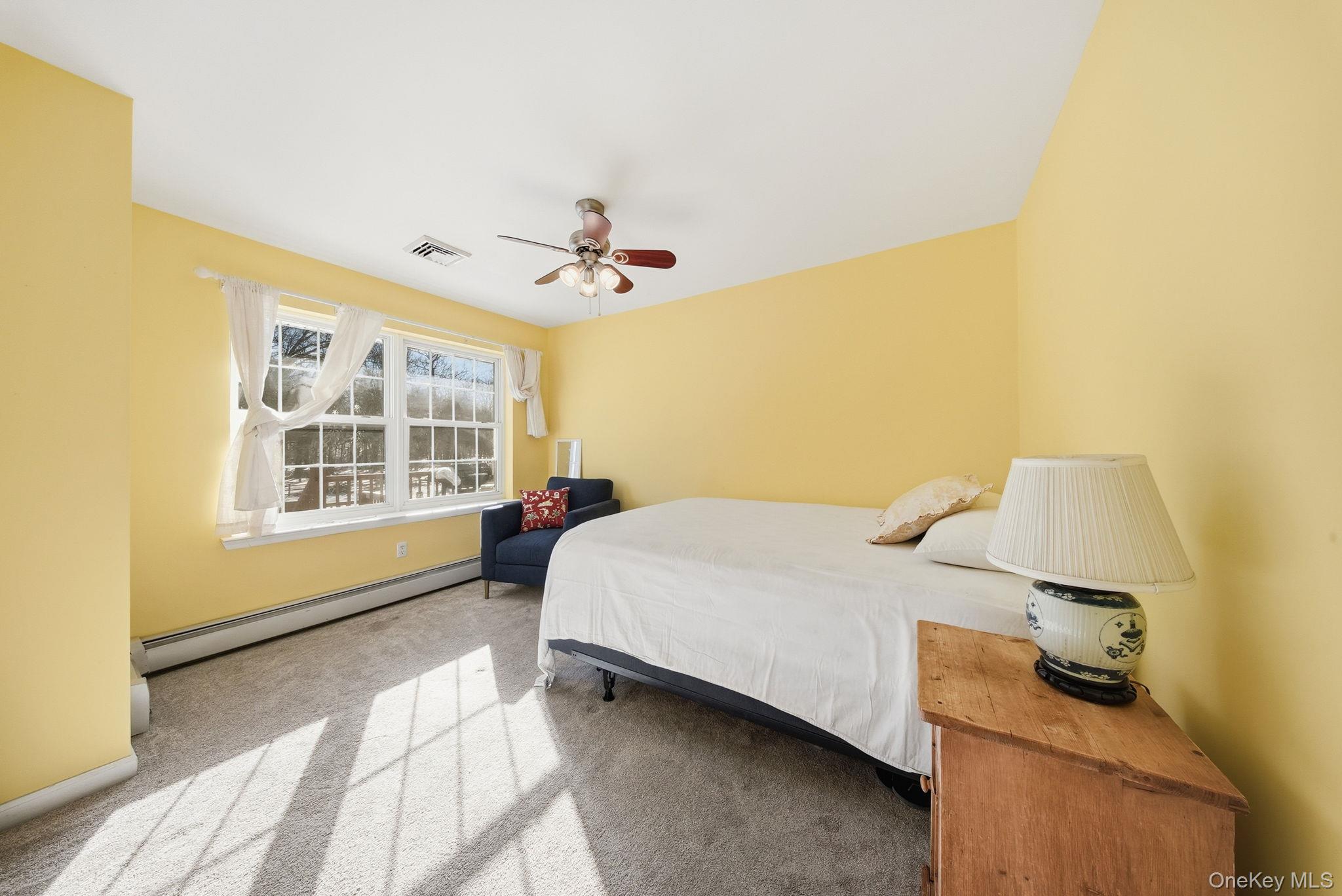 100 Maybrook Road Campbell Hall, NY 10916 - Photo 13 of 32 a bedroom with a bed and wooden floor