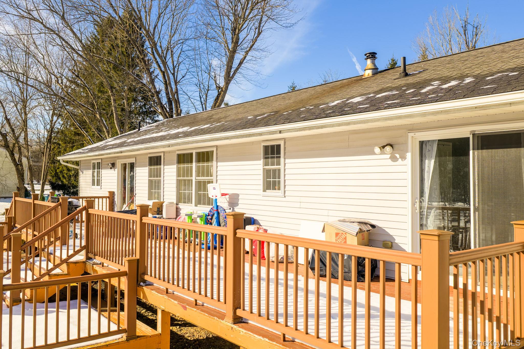 100 Maybrook Road Campbell Hall, NY 10916 - Photo 23 of 32 a porch with a bench next to a yard