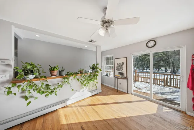 a view of an entryway with wooden floor