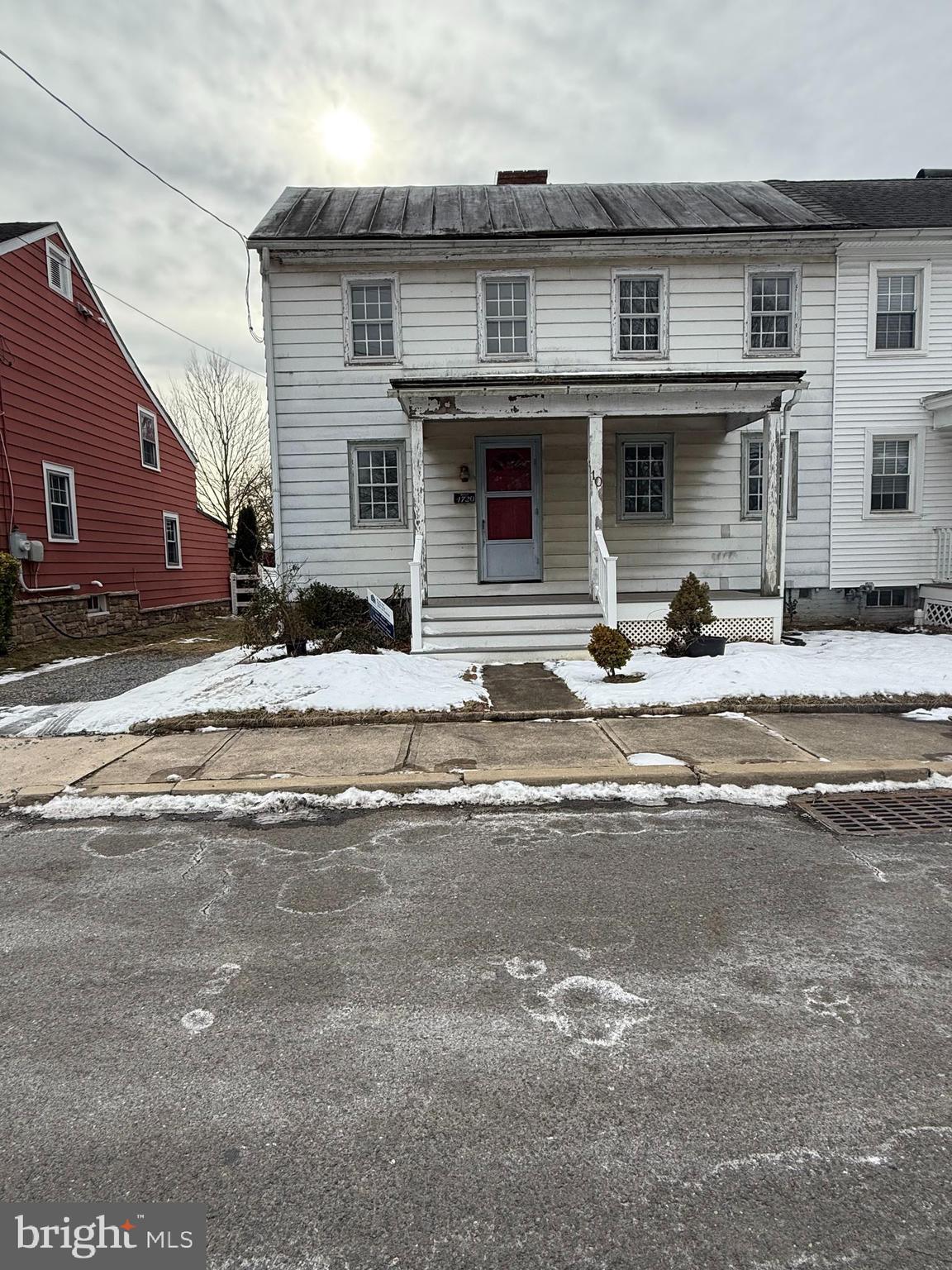 10 Front Street Chesterfield, NJ 08515 - Photo 2 of 3 a front view of a house with a yard and a car parked on road
