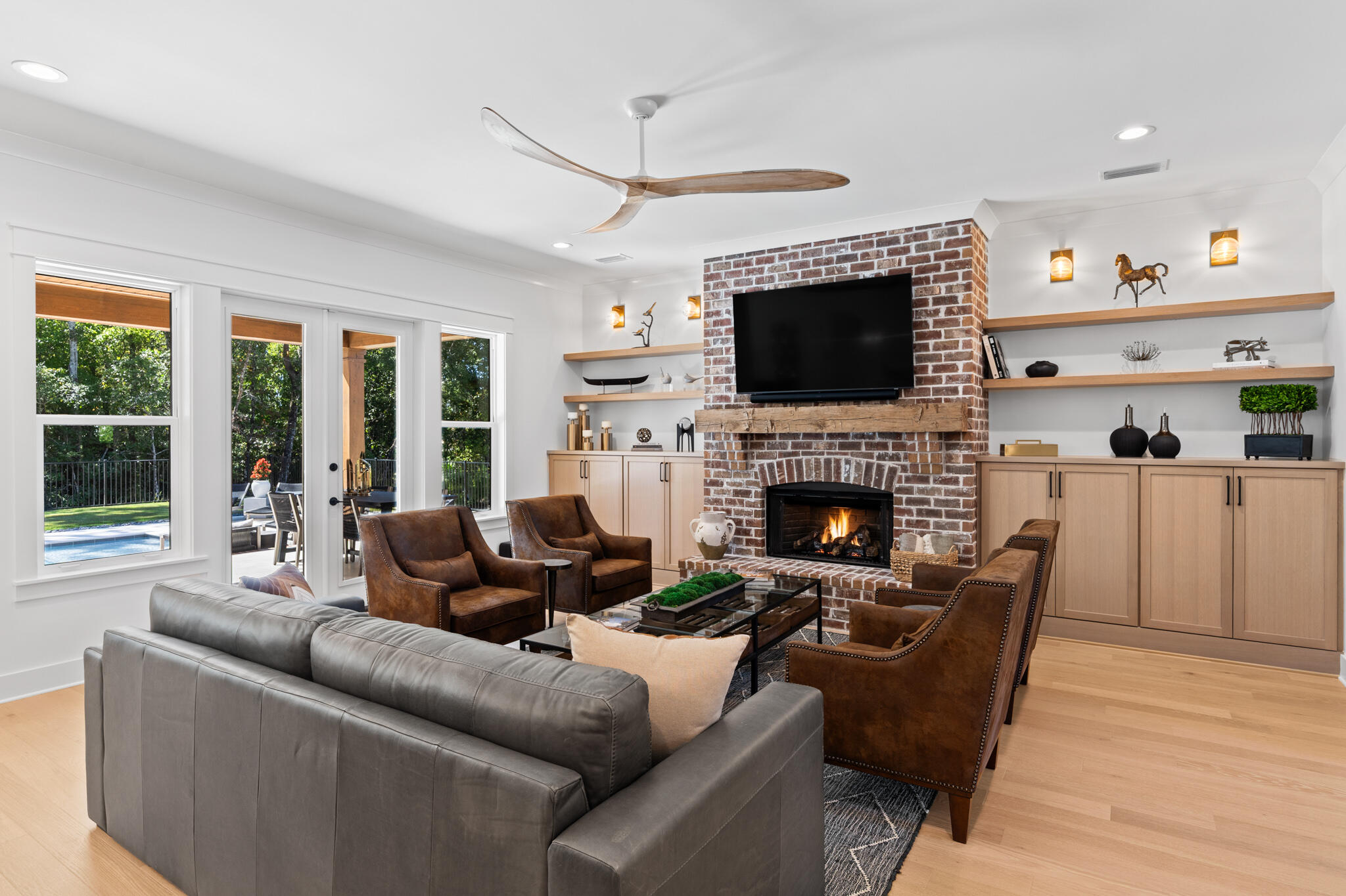 26 Caymus Cove Freeport, FL 32439 - Photo 5 of 13 a living room with furniture a flat screen tv and a fireplace