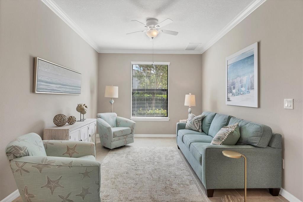 13703 Messina Loop, Unit 104 Bradenton, FL 34211 - Photo 11 of 86 a living room with furniture and a large window