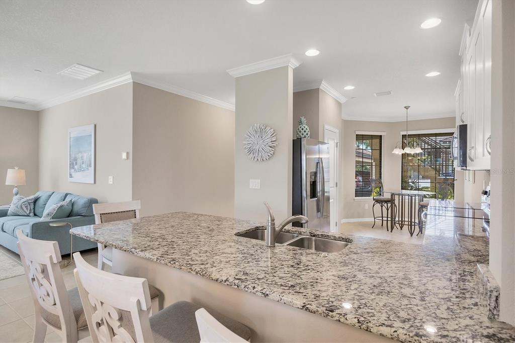 13703 Messina Loop, Unit 104 Bradenton, FL 34211 - Photo 13 of 86 a living room with furniture and a table
