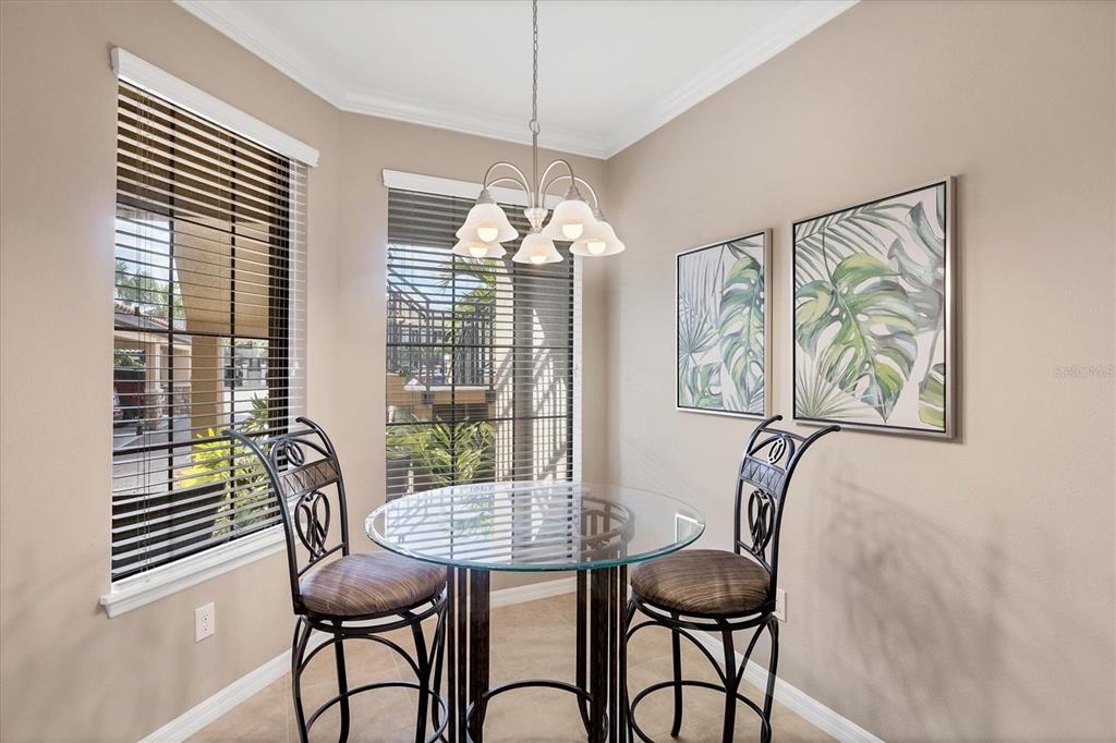 13703 Messina Loop, Unit 104 Bradenton, FL 34211 - Photo 19 of 86 a view of a dining room with furniture window and outside view