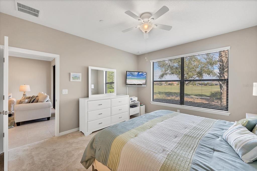 13703 Messina Loop, Unit 104 Bradenton, FL 34211 - Photo 22 of 86 a bedroom with a large bed and a window