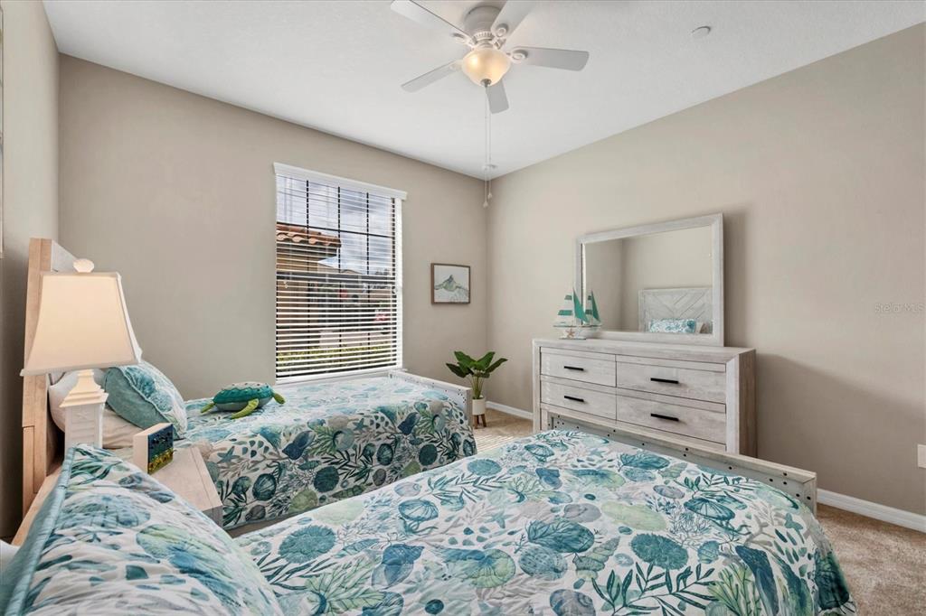 13703 Messina Loop, Unit 104 Bradenton, FL 34211 - Photo 25 of 86 a bed room with a bed and a dresser