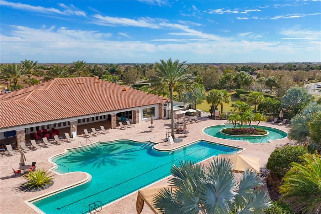 13703 Messina Loop, Unit 104 Bradenton, FL 34211 - Photo 35 of 86 an aerial view of a house with swimming pool garden and patio