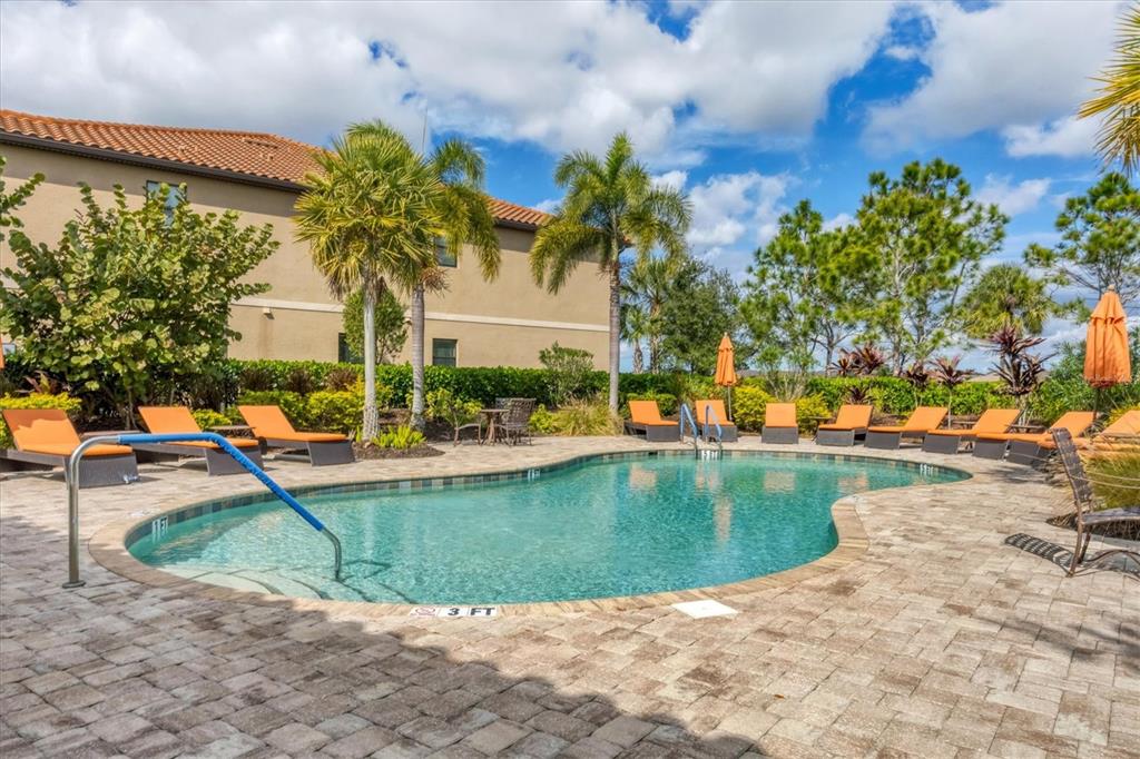 13703 Messina Loop, Unit 104 Bradenton, FL 34211 - Photo 36 of 86 a view of a swimming pool with a patio