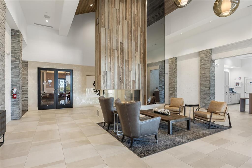 13703 Messina Loop, Unit 104 Bradenton, FL 34211 - Photo 44 of 86 a living room with furniture and large windows